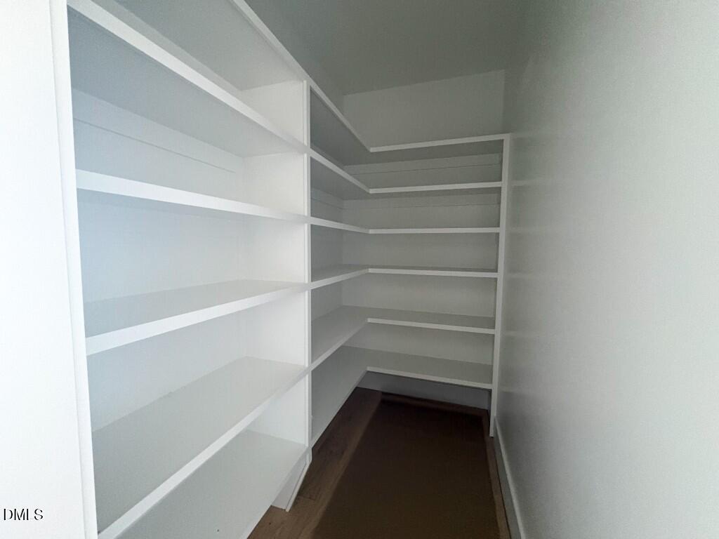 5864 Carriage Gate Drive Raleigh, NC 27603 - Photo 7 of 37 a view of walk in closet with empty racks