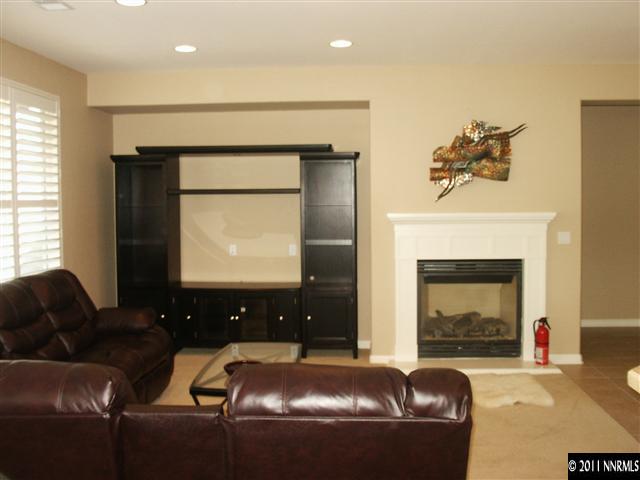 1110 Meridian Ranch Drive Reno, NV 89523 - Photo 5 of 11 a living room with furniture and a fireplace