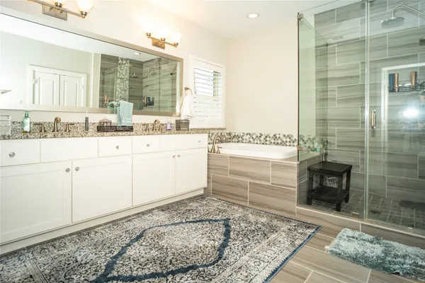 a bathroom with a sink a vanity and a mirror
