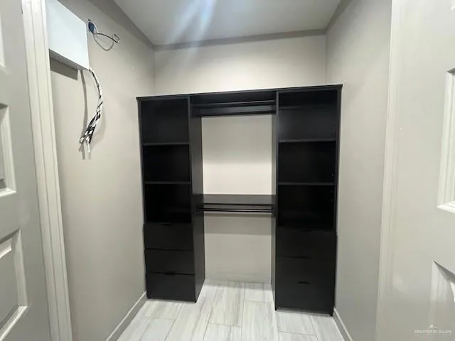 a bathroom with a walk in closet
