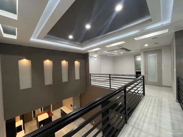 a lobby with furniture and stairs
