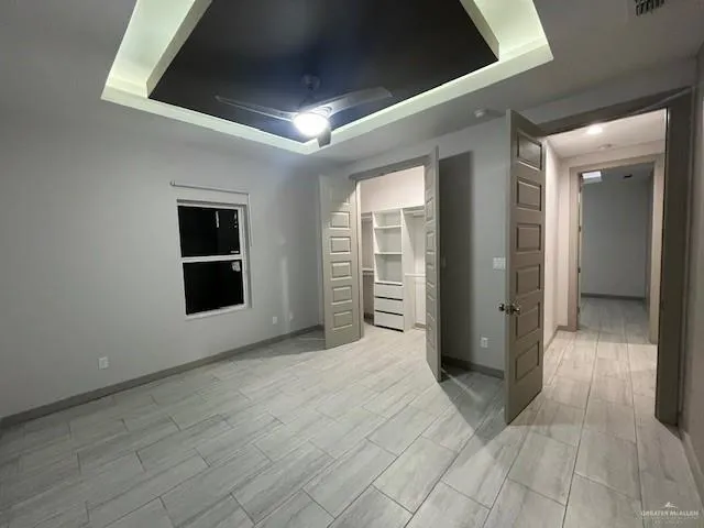 a view of a hallway with wooden shelves