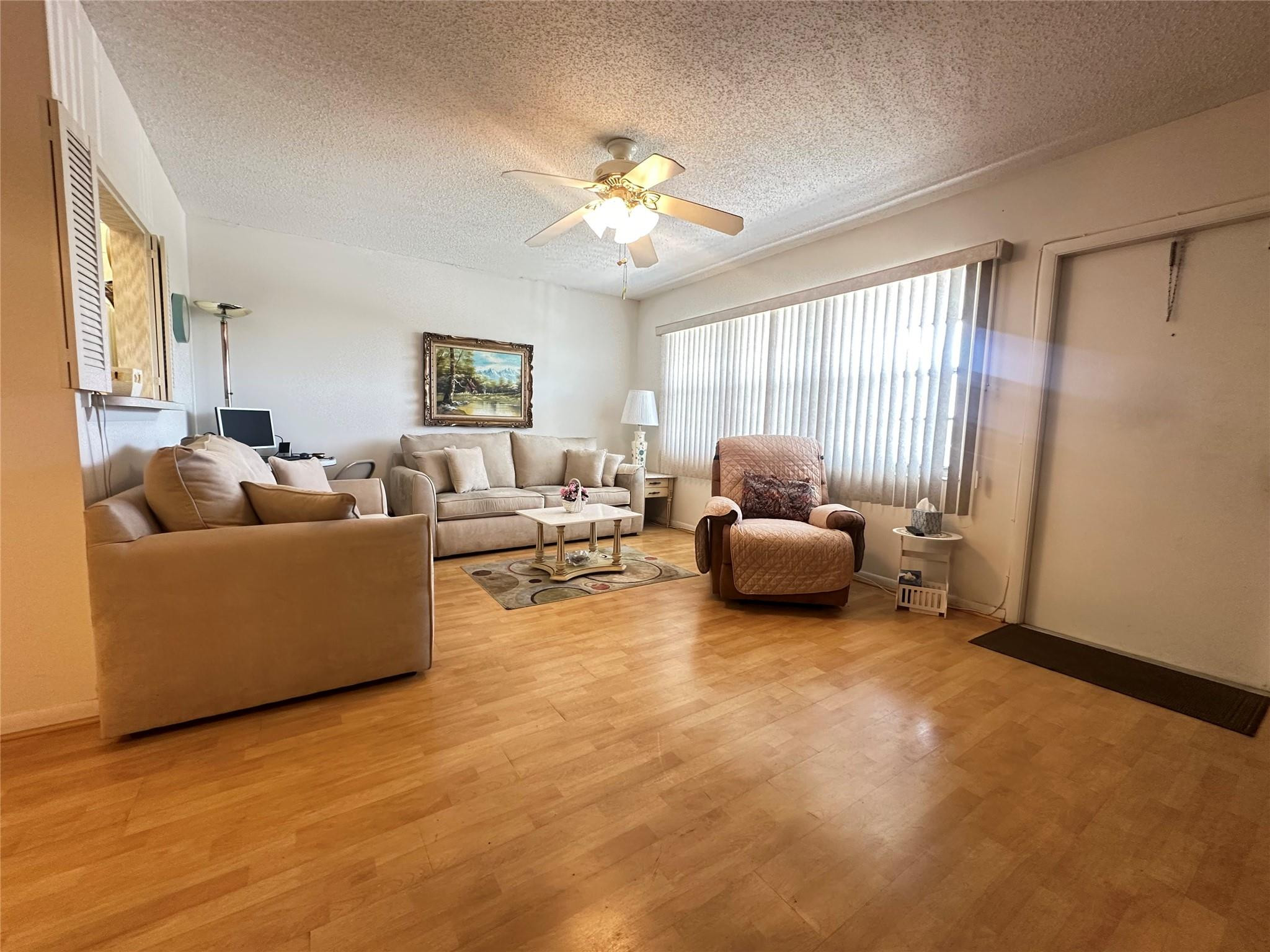 263 Farnham K, Unit 263 Deerfield Beach, FL 33442 - Photo 3 of 48 a living room with furniture and a window