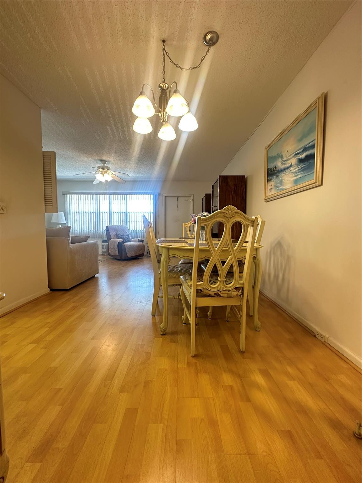 263 Farnham K, Unit 263 Deerfield Beach, FL 33442 - Photo 8 of 48 a view of a dining room with furniture and a chandelier