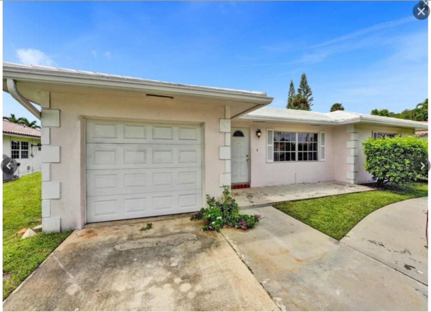 22062 Acapulco Court Boca Raton, FL 33428 - Photo 1 of 9 a front view of a house with a yard and garage