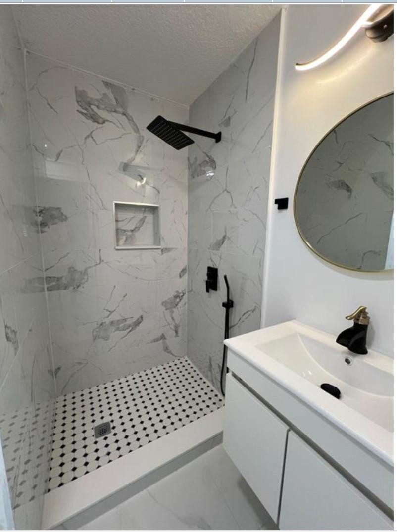 22062 Acapulco Court Boca Raton, FL 33428 - Photo 5 of 9 a bathroom with a sink and a mirror