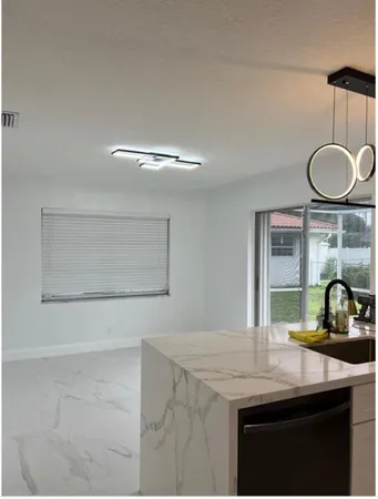 an empty room with closet and wooden floor