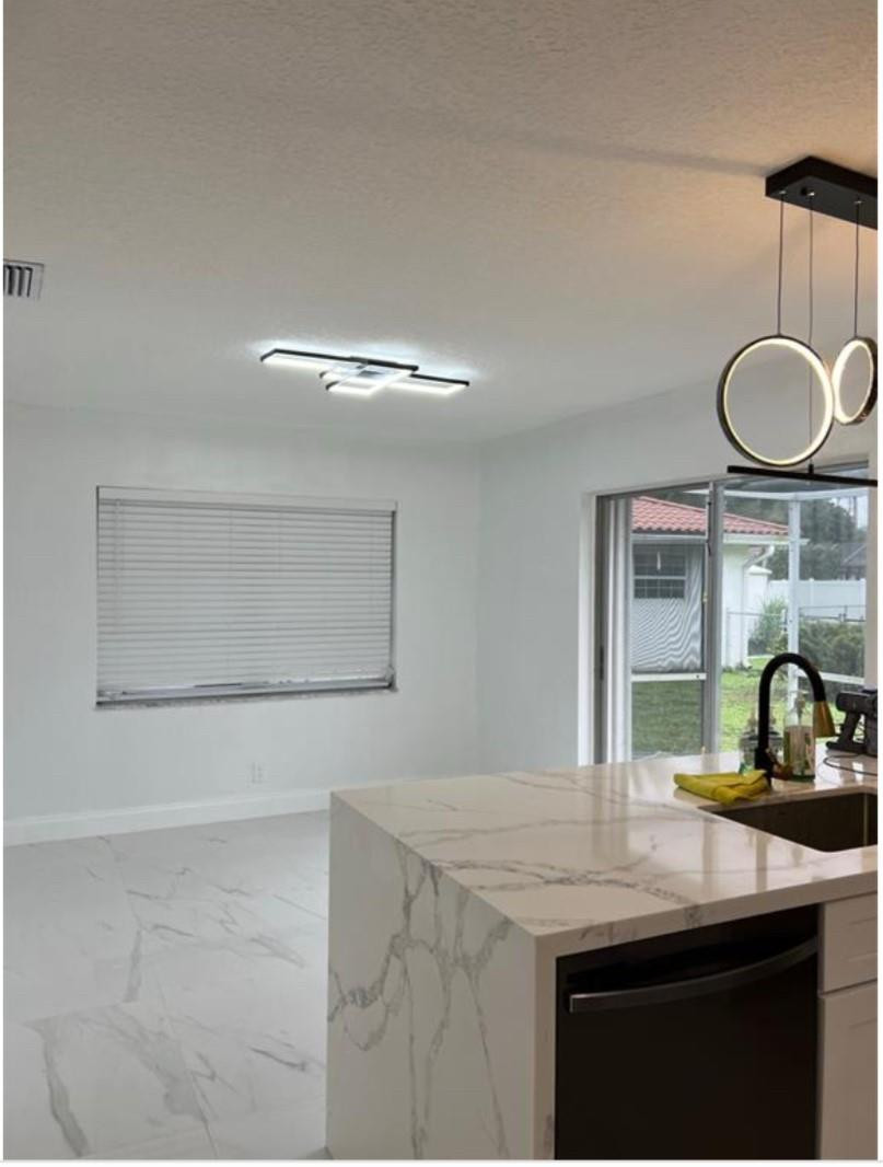 22062 Acapulco Court Boca Raton, FL 33428 - Photo 7 of 9 a kitchen with a sink and a mirror