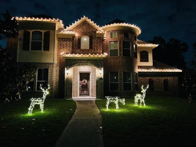a front view of a house with a yard table and chairs