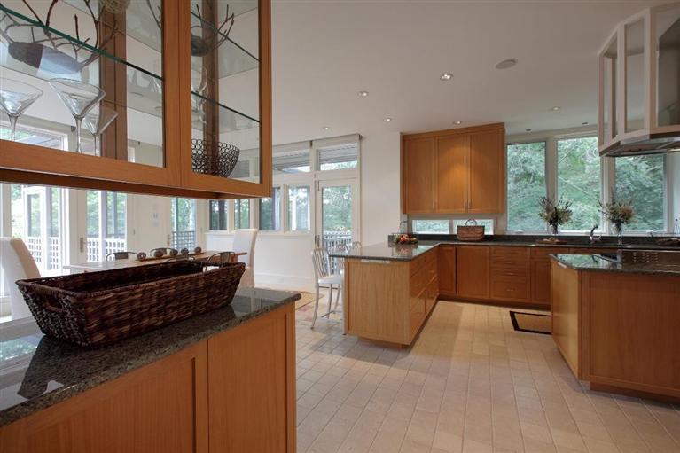 5 Mute Swan Circle Mashpee, MA 02649 - Photo 12 of 34 a large kitchen with kitchen island granite countertop a sink and a large window