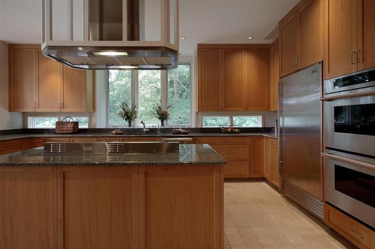 5 Mute Swan Circle Mashpee, MA 02649 - Photo 13 of 34 a kitchen with kitchen island granite countertop a sink cabinets and stainless steel appliances