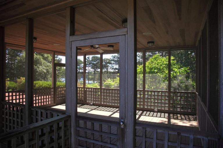 5 Mute Swan Circle Mashpee, MA 02649 - Photo 25 of 34 a view of a glass door and wooden floor