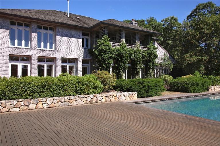 5 Mute Swan Circle Mashpee, MA 02649 - Photo 28 of 34 a front view of a house with a yard and potted plants
