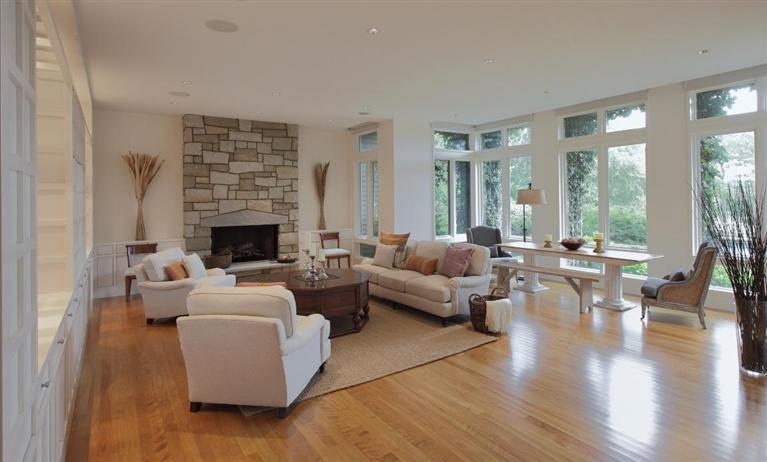5 Mute Swan Circle Mashpee, MA 02649 - Photo 5 of 34 a living room with furniture wooden floor and a fireplace