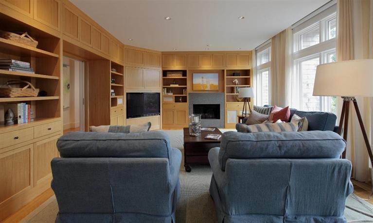 5 Mute Swan Circle Mashpee, MA 02649 - Photo 9 of 34 a living room with furniture and a fireplace