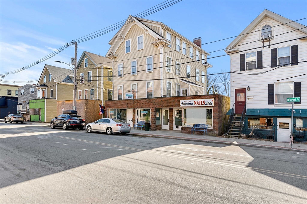 126 Pleasant Street Marblehead, MA 01945 - Photo 2 of 20 a view of a street that has couple of cars parked on the road