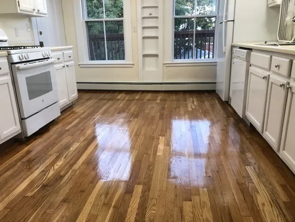 a view of a kitchen with wooden floor and floors