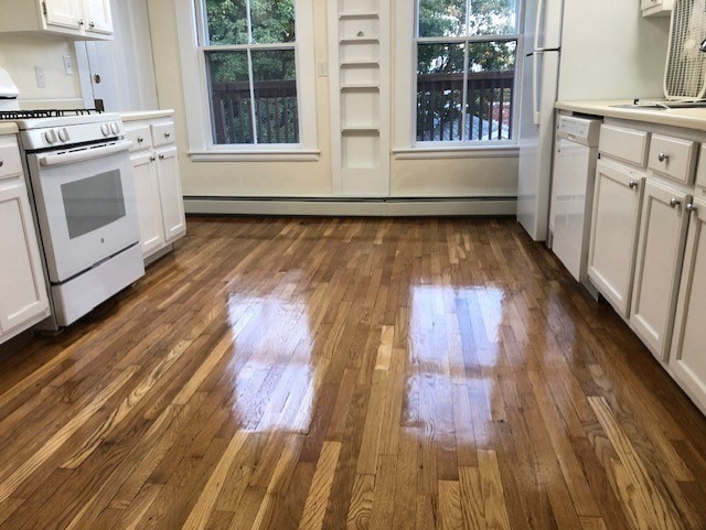 126 Pleasant Street Marblehead, MA 01945 - Photo 7 of 20 a view of a kitchen with wooden floor and floors