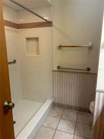a bathroom with a shower and a tub