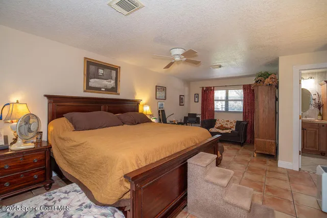 a bedroom with a bed and dresser