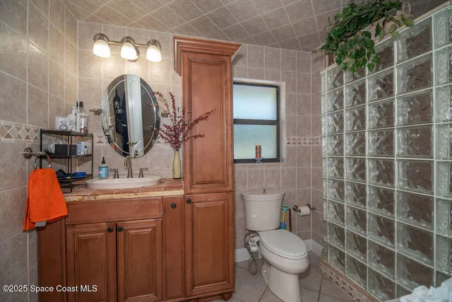 a view of a bathroom with a sink and a mirror