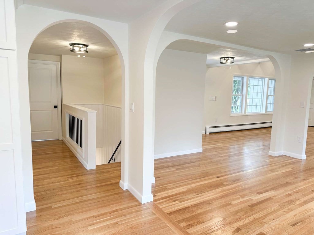 123 Burbank Road Sutton, MA 01590 - Photo 12 of 20 wooden floor in an empty room with a mirror