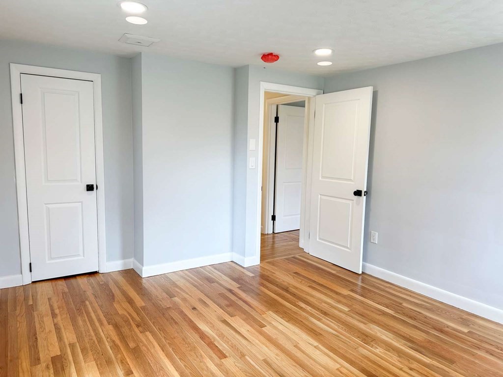 123 Burbank Road Sutton, MA 01590 - Photo 14 of 20 a view of a livingroom with wooden floor and closet