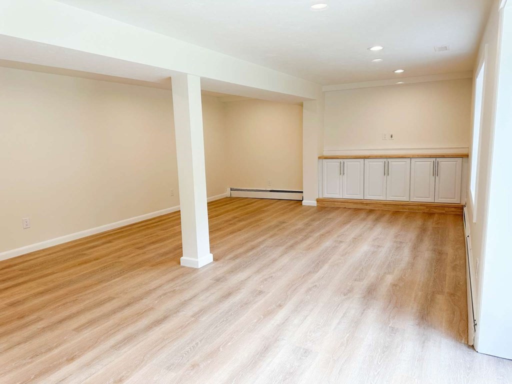 123 Burbank Road Sutton, MA 01590 - Photo 19 of 20 wooden floor in an empty room with a window