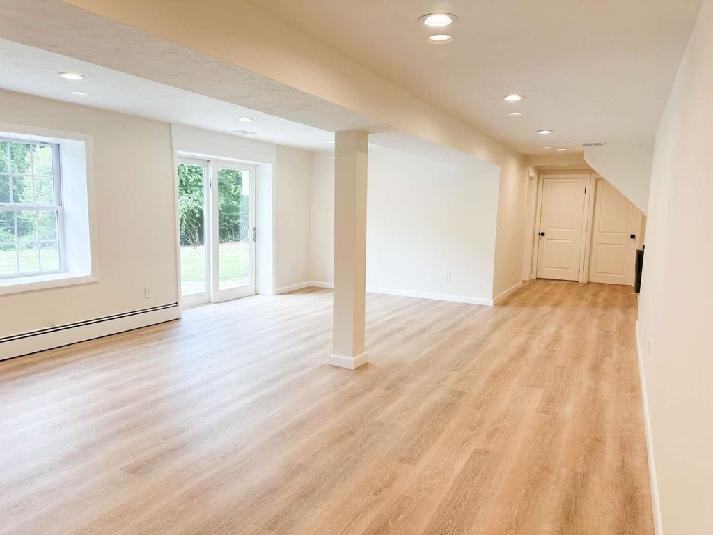 123 Burbank Road Sutton, MA 01590 - Photo 20 of 20 a view of empty room with wooden floor and fan