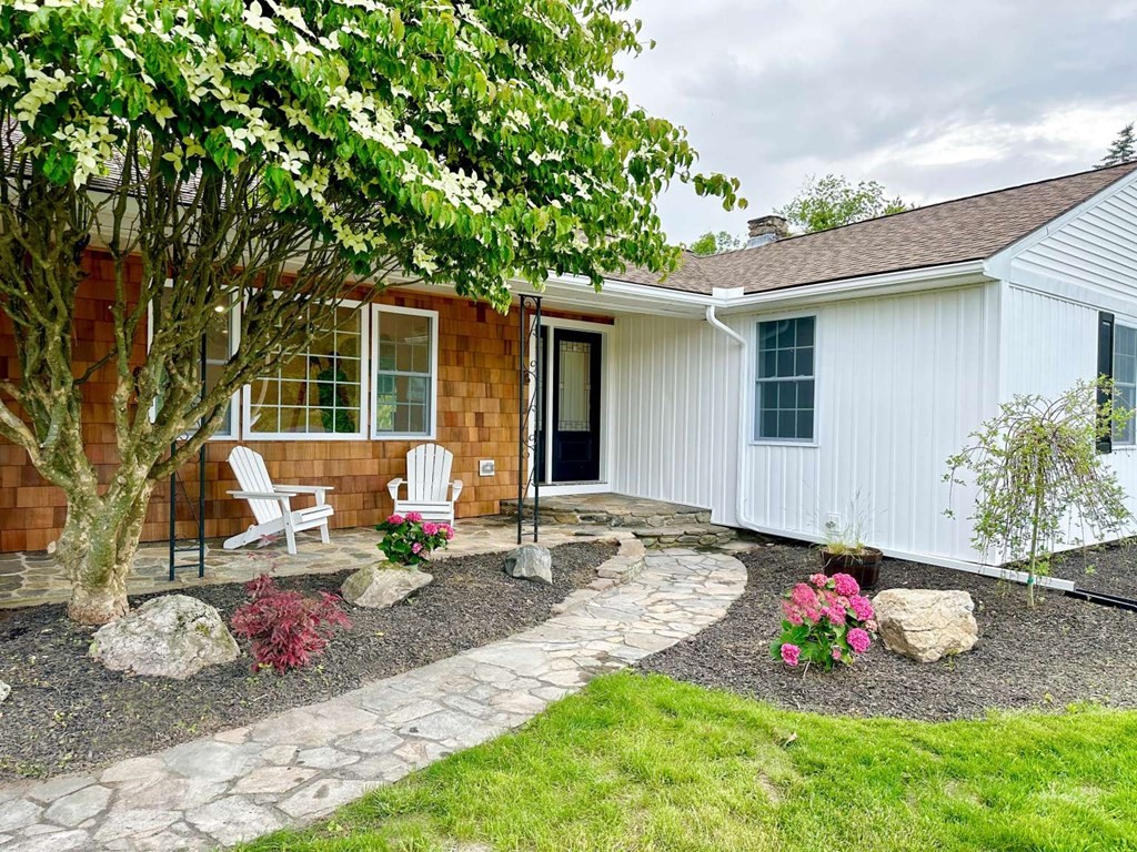 123 Burbank Road Sutton, MA 01590 - Photo 2 of 20 a backyard of a house with seating space