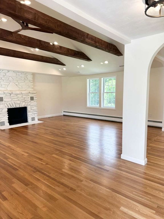 123 Burbank Road Sutton, MA 01590 - Photo 5 of 20 a view of empty room with wooden floor and fireplace