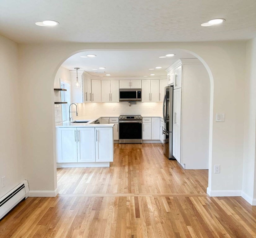 123 Burbank Road Sutton, MA 01590 - Photo 6 of 20 a large kitchen with cabinets and stainless steel appliances