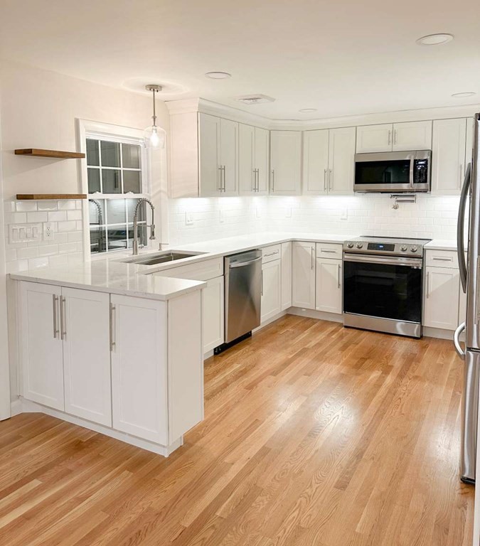 123 Burbank Road Sutton, MA 01590 - Photo 8 of 20 a kitchen with stainless steel appliances granite countertop a stove and a sink