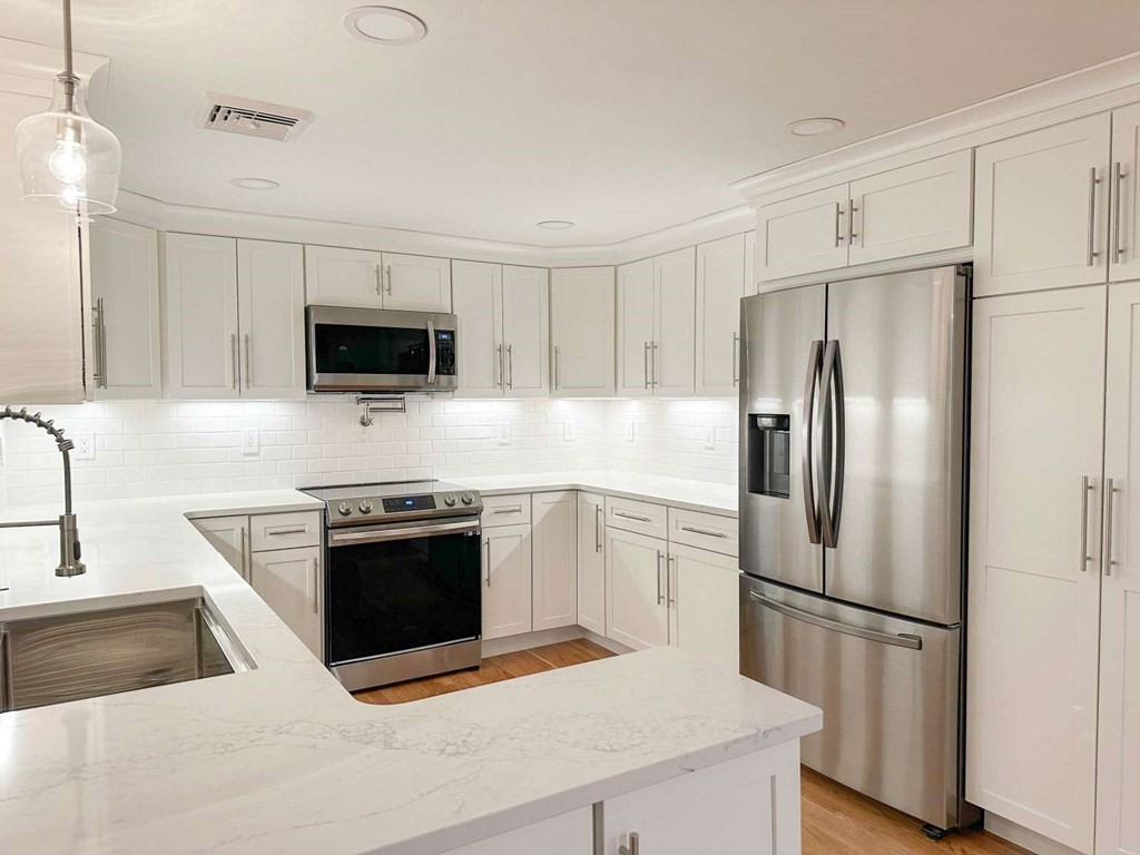 123 Burbank Road Sutton, MA 01590 - Photo 9 of 20 a kitchen with stainless steel appliances a refrigerator stove and microwave