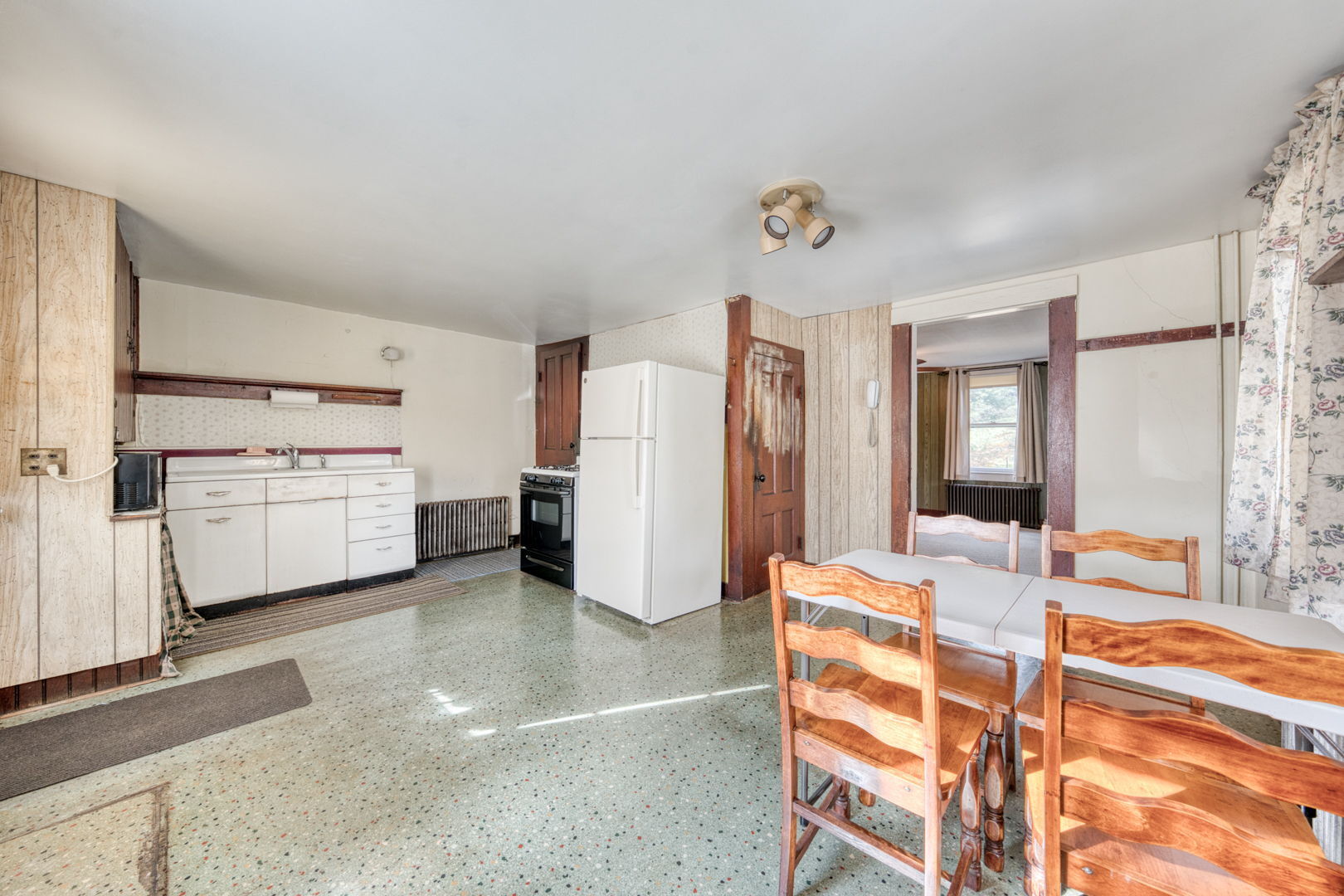 287 Maple Road Mansfield, CT 06268 - Photo 13 of 38 a view of a kitchen with refrigerator and wooden floor