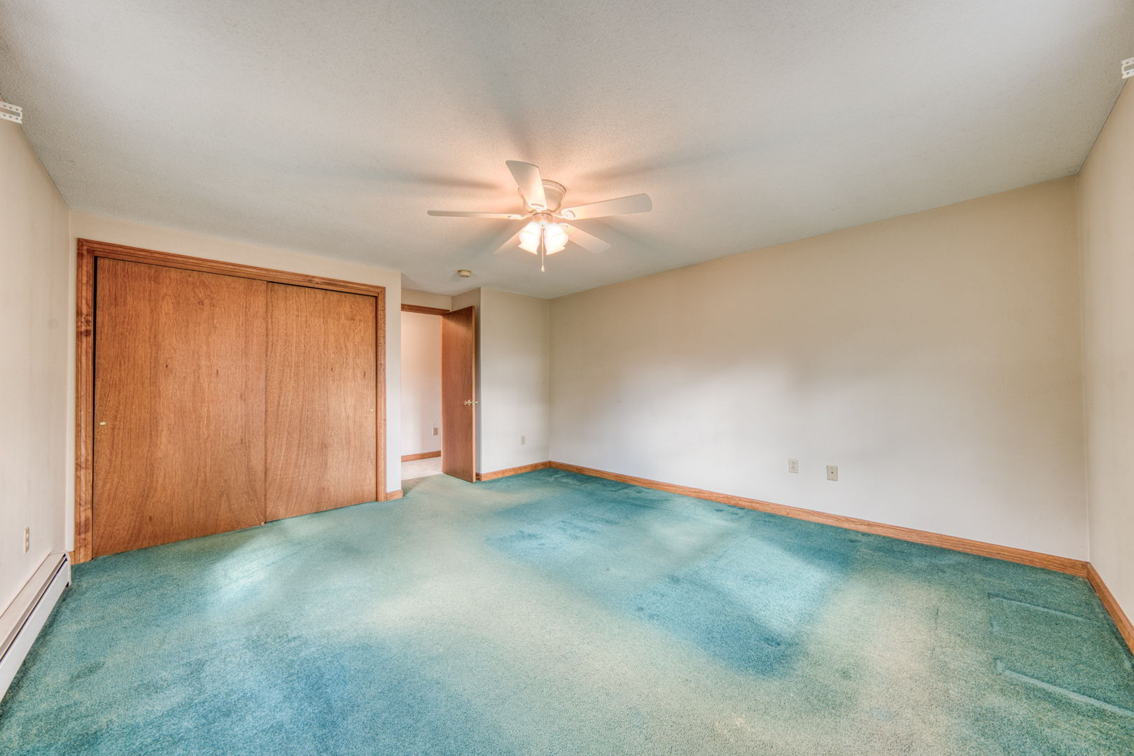 287 Maple Road Mansfield, CT 06268 - Photo 20 of 38 an empty room with a ceiling fan and a window