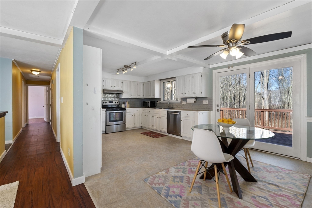 6 True Road Salisbury, MA 01952 - Photo 13 of 40 a view of a dining room with furniture window and wooden floor