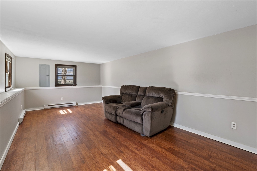6 True Road Salisbury, MA 01952 - Photo 23 of 40 a living room with furniture and a wooden floor