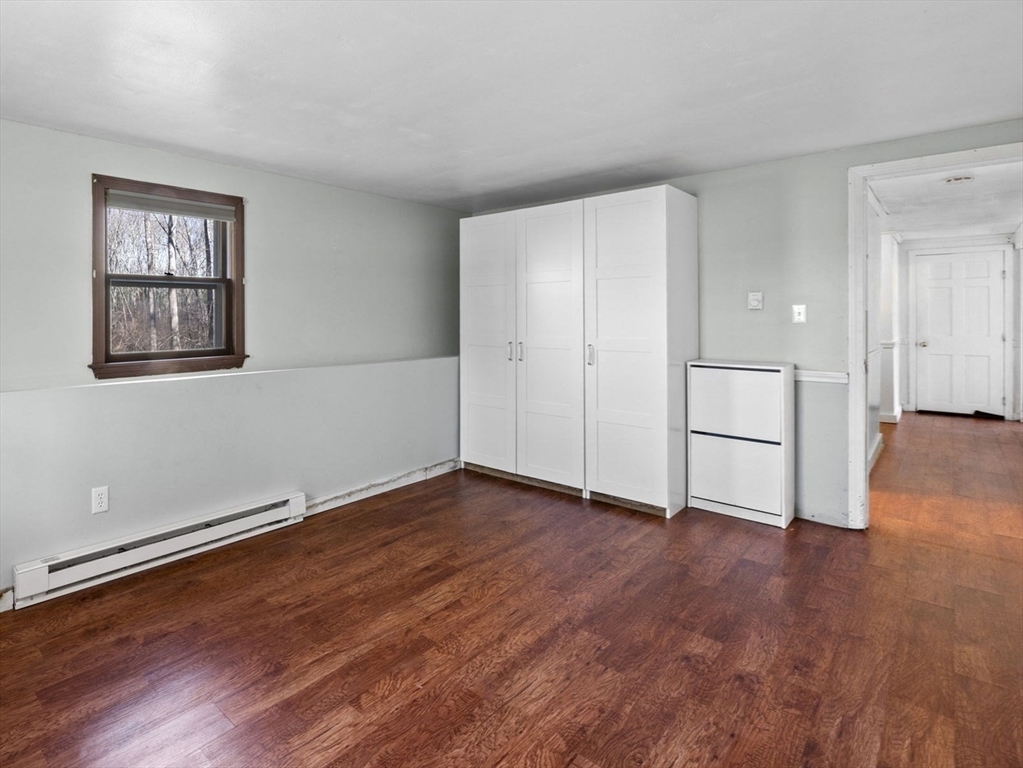 6 True Road Salisbury, MA 01952 - Photo 27 of 40 a view of empty room with wooden floor and window