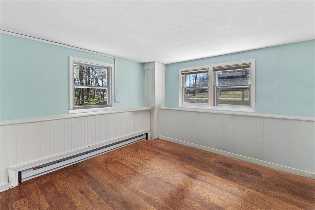 6 True Road Salisbury, MA 01952 - Photo 29 of 40 a view of an empty room with a window and wooden floor
