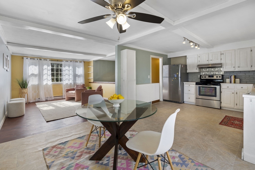 6 True Road Salisbury, MA 01952 - Photo 8 of 40 a living room with stainless steel appliances kitchen island granite countertop furniture and a large window