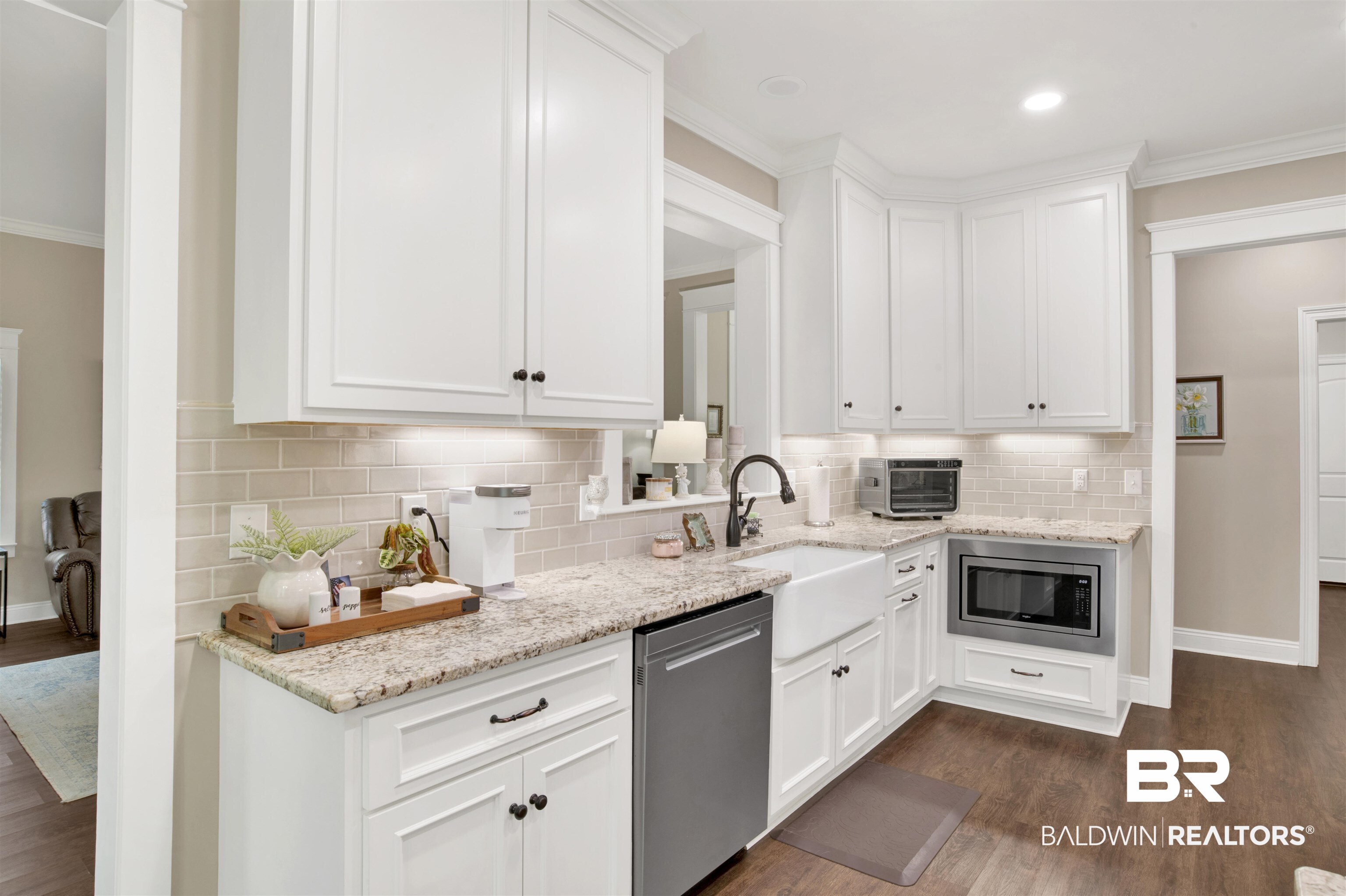 2440 Johnson Road West Mobile, AL 36695 - Photo 15 of 40 Kitchen featuring white cabinets, sink, appliances with stainless steel finishes, and dark wood-type flooring