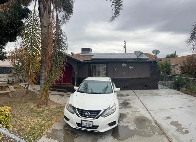 a car parked in front of a house