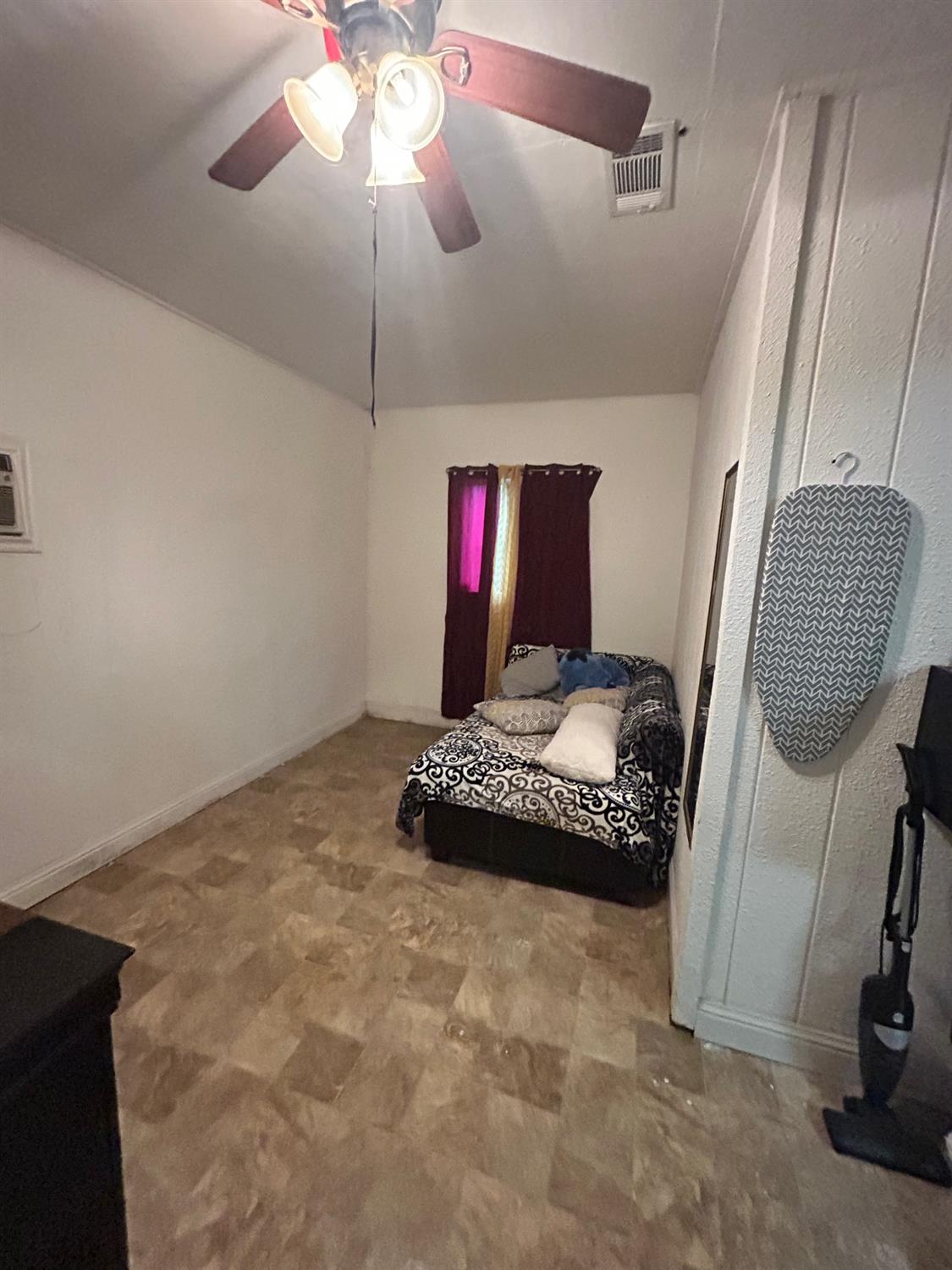 921 Atlantic Drive Modesto, CA 95358 - Photo 15 of 16 a room with toys and a view of chandelier