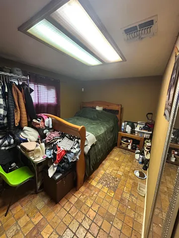 a room with stainless steel appliances kitchen island granite countertop furniture and a view of kitchen