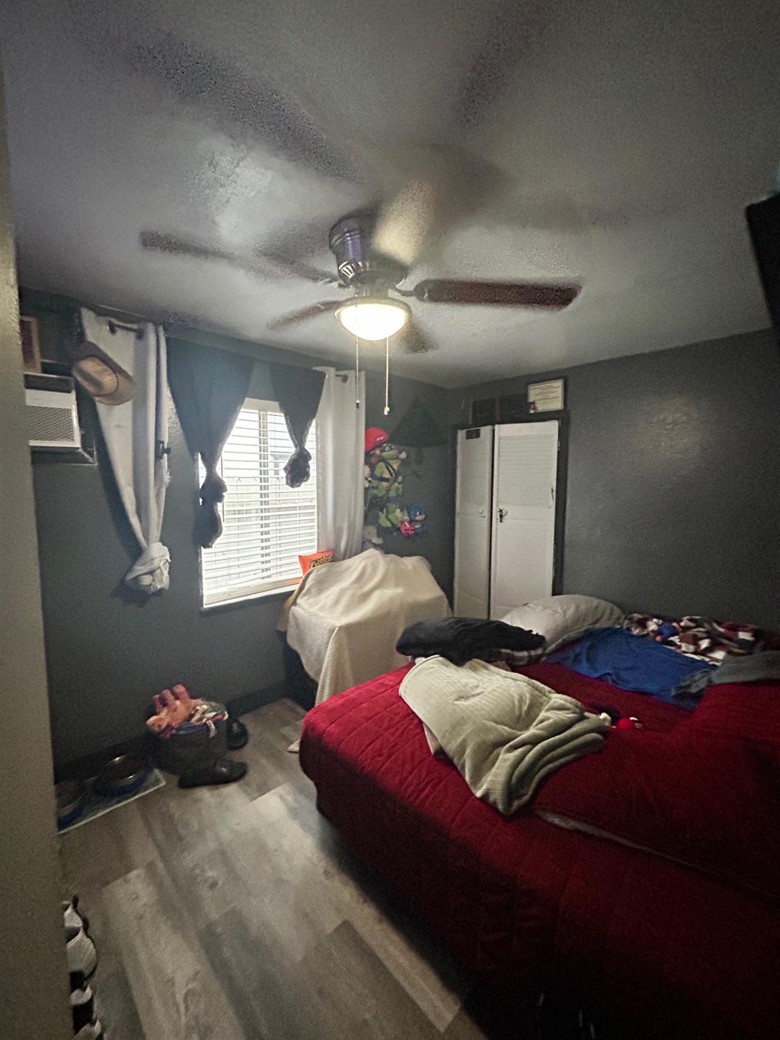 921 Atlantic Drive Modesto, CA 95358 - Photo 7 of 16 a bedroom with bed and window