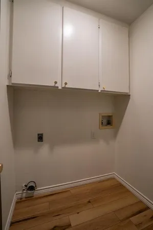 an empty room with wooden floor