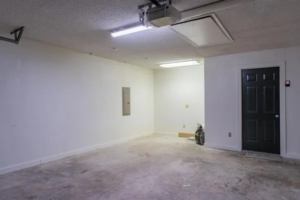 an empty room with a ceiling fan
