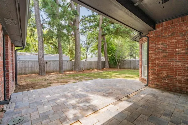 a view of a house with backyard and a backyard