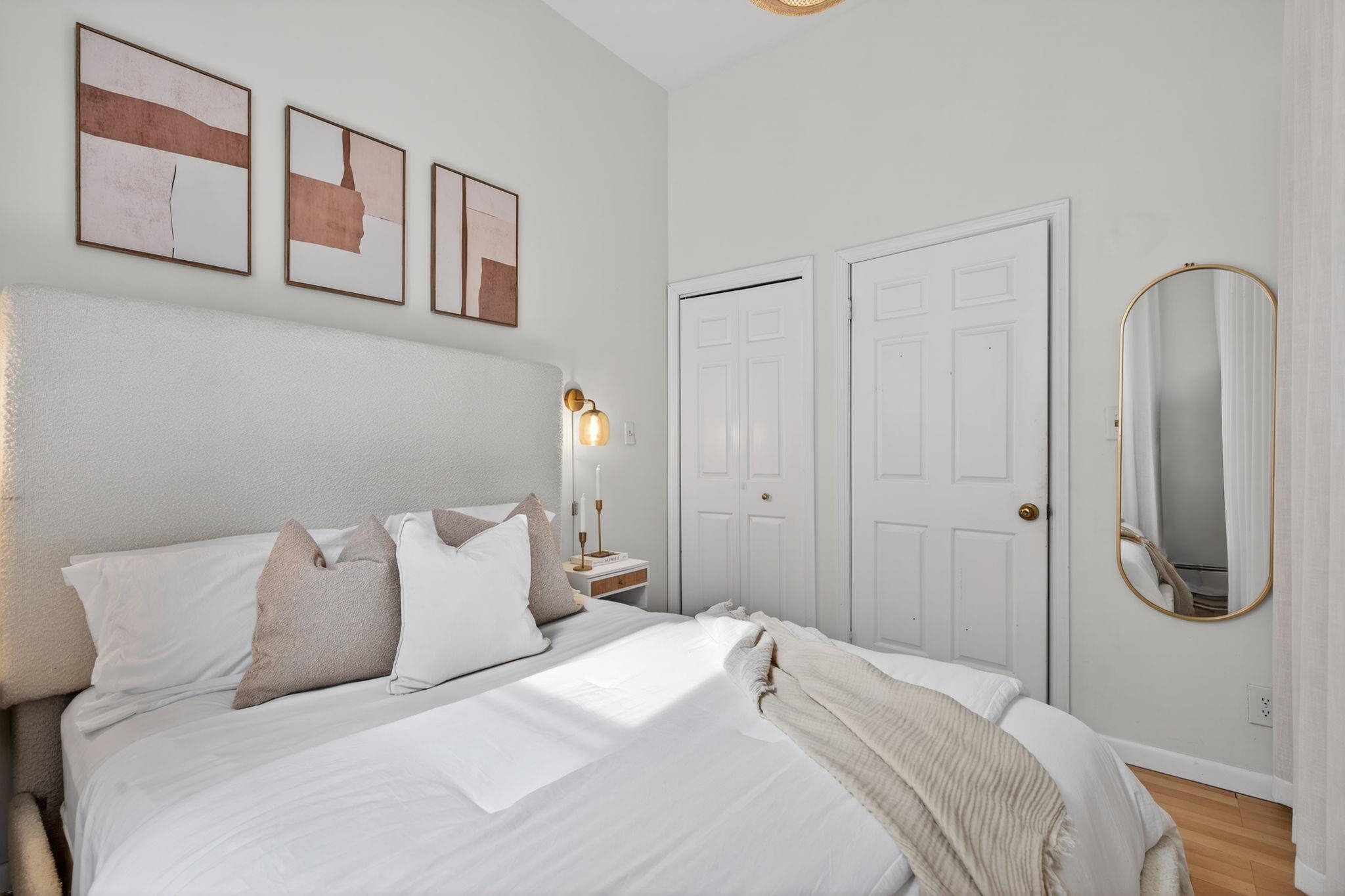 723 Washington Street, Unit 5 Hoboken, NJ 07030 - Photo 14 of 25 a bedroom with a bed and a painting on the wall